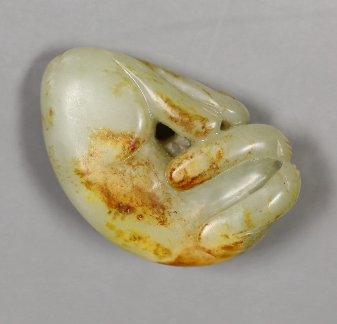 A Chinese jade carving of a sleeping dog, 6cm wide